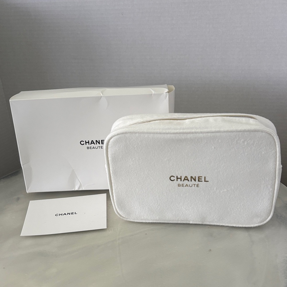 CHANEL White Cosmetic Travel Pouch with Gold Logo
And Chanel Card